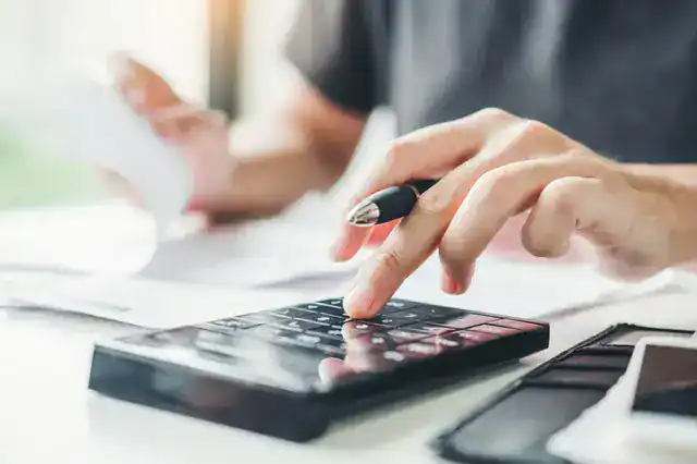 business-person-calculating-price